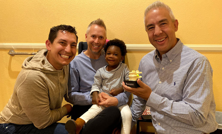 Parents and their young child with a chiropractor at Spinal Care of Nevada in Summerlin, Las Vegas